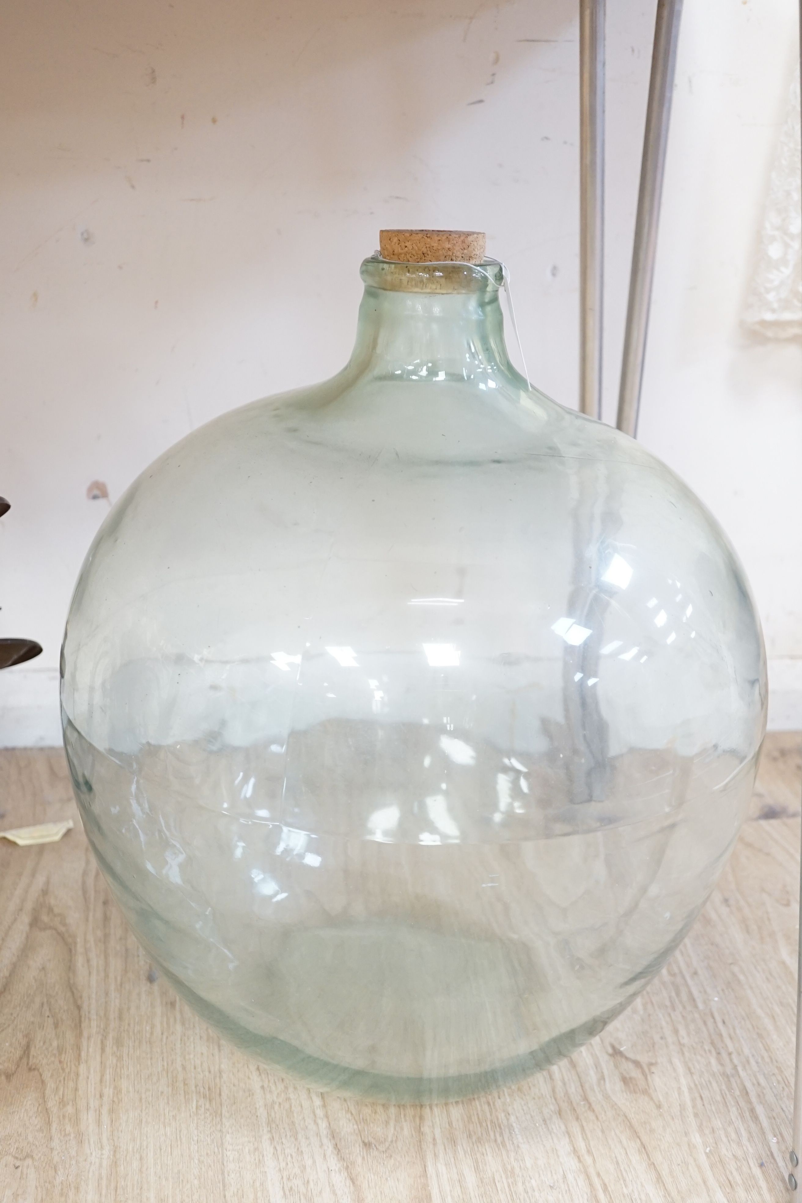 A large moulded glass carboy, approx 57 cms high.